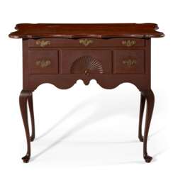 A QUEEN ANNE CARVED CHERRYWOOD DRESSING TABLE