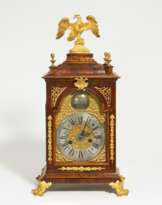 Veneered rococo commode clock with gilt bronze appliqués