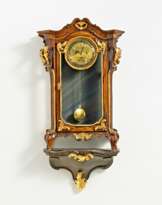 Wooden rococo clock on console