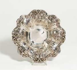 Silver serving bowl with grapes and pomegranates