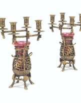 A PAIR OF FRENCH PARCEL-GILT AND PATINATED-BRONZE FOUR-LIGHT CANDLEABRA