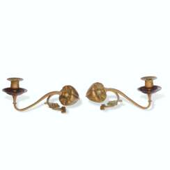 A PAIR OF BRASS AND COPPER CANDLE HOLDERS