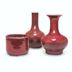 TWO CHINESE COPPER-RED GLAZED VASES AND A CHINESE COPPER-RED GLAZED CENSER