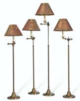 A SET OF FOUR FRENCH TELESCOPIC EXTENDABLE BRASS FLOOR LAMPS