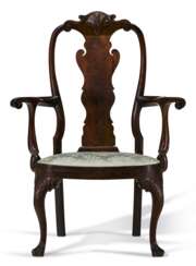 A MAGNIFICENT QUEEN ANNE CARVED WALNUT ARMCHAIR
