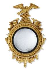 A CLASSICAL EAGLE-CARVED GILTWOOD CONVEX MIRROR