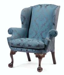 A CHIPPENDALE CARVED MAHOGANY EASY CHAIR