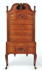 A QUEEN ANNE FIGURED MAPLE HIGH CHEST-OF-DRAWERS