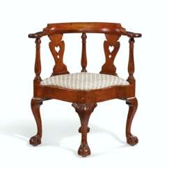 A CHIPPENDALE CARVED MAHOGANY CORNER CHAIR