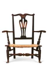 A CHIPPENDALE BLACK-PAINTED MAPLE SLIPPER ARMCHAIR