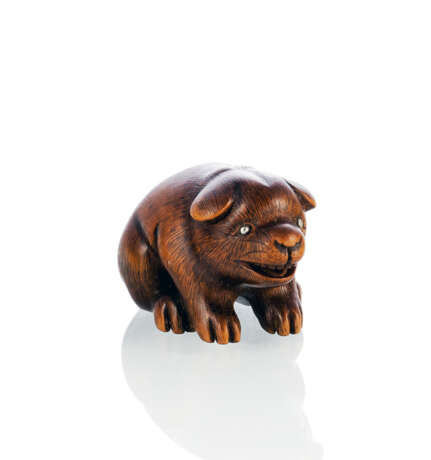 Netsuke eines Hündchens aus Buchsbaum mit in Silber eingelegten Pupillen - photo 1