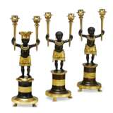 A GROUP OF THREE DIRECTOIRE ORMOLU AND PATINATED BRONZE TWIN-BRANCH CANDELABRA - photo 1