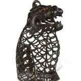 A LARGE BRONZE RETICULATED BEAST-FORM LANTERN - photo 1