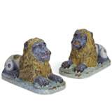 A PAIR OF FRENCH FAIENCE MODELS OF RECUMBENT LIONS - фото 1
