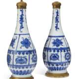 A PAIR OF ORMOLU-MOUNTED CHINESE PORCELAIN BLUE AND WHITE BOTTLE VASES - photo 1