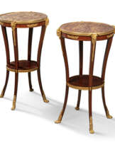 A PAIR OF FRENCH ORMOLU-MOUNTED MAHOGANY GUERIDONS
