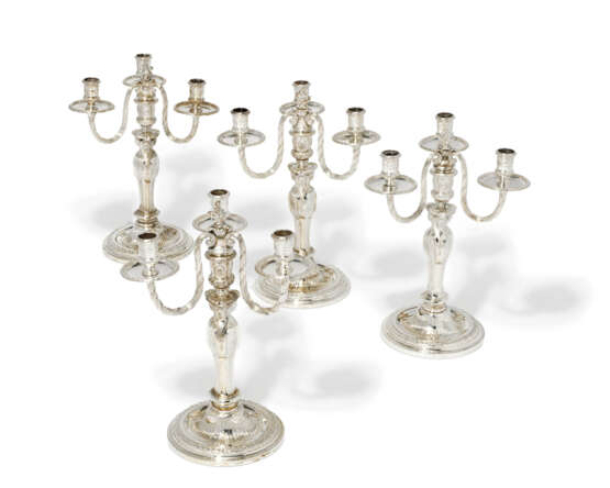 A SET OF FOUR CONTINENTAL SILVER THREE-BRANCH CANDELABRA - photo 1
