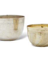 TWO GERMAN SILVER AND PARCEL-GILT SILVER TUMBLER CUPS
