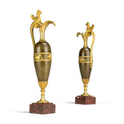 A PAIR OF EMPIRE ORMOLU-MOUNTED PATINATED-BRONZE EWERS