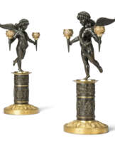 A PAIR OF EMPIRE GILT AND PATINATED BRONZE TWIN-LIGHT CANDELABRA