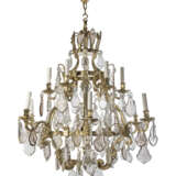 A FRENCH BRASS AND CUT AND MOULDED-GLASS TWELVE-LIGHT CHANDELIER - photo 1