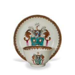 A CHINESE EXPORT PORCELAIN ARMORIAL 'MISTAKE' TEABOWL AND SAUCER