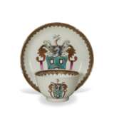 A CHINESE EXPORT PORCELAIN ARMORIAL 'MISTAKE' TEABOWL AND SAUCER - photo 1