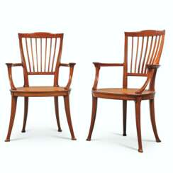A PAIR OF FRENCH ART NOUVEAU CARVED MAHOGANY OPEN ARMCHAIRS
