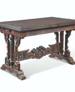Japonismus. A FRENCH &#39;JAPONISME&#39; STAINED BEECH DRAW-LEAF LIBRARY TABLE