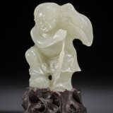 A SMALL GREENISH-WHITE JADE FIGURE OF LIU HAI - photo 1