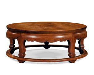 AN UNUSUAL HUANGHUALI ROUND LOW TABLE