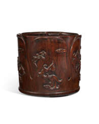 A LARGE CARVED HUANGHUALI FLORIFORM &#39;CHILONG&#39; BRUSH POT