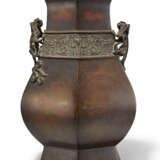 A LARGE BRONZE ARCHAISTIC FACETED VASE WITH BEAST-FORM HANDLES - photo 1