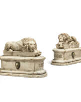 A PAIR OF ITALIAN ALABASTER RECUMBENT LIONS