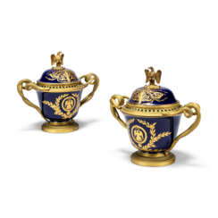A PAIR OF FRENCH ORMOLU-MOUNTED SEVRES-STLYE COBALT BLUE-GROUND PORCELAIN VASES AND COVERS