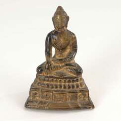 Kleiner sitzender Buddha.