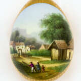 A RUSSIAN PORCELAIN EASTER EGG SHOWING A VILLAGE SCENE - фото 1