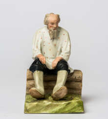 A RUSSIAN PORCELAIN FIGURE SHOWING AN OLD MAN