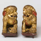 TWO CHINESE GILDED WOODEN GUARDIAN LIONS - photo 1