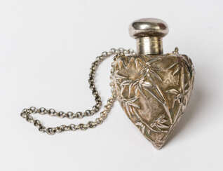 A HEART-SHAPED SILVER PERFUME BOTTLE