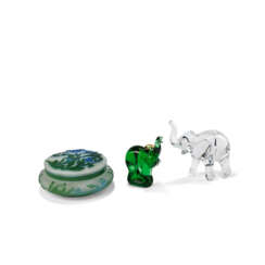 A BACCARAT LOET TANGANYIKA ELEPHANT CRYSTAL FIGURINE; TOGETHER WITH AN ELEPHANT GLASS FIGURINE AND A BOWL AND COVER