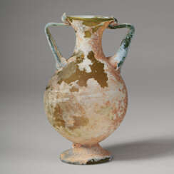 A LATE ROMAN GREEN GLASS TWO-HANDLED FLASK