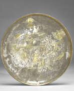 Empire sassanide (224-651). A SASANIAN PARCEL GILT SILVER FOOTED PLATE WITH NARSEH