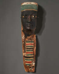 AN EGYPTIAN PAINTED WOOD MUMMY PORTRAIT