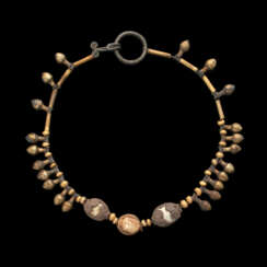 A PHOENICIAN ELECTRUM, GOLD, SILVER AND STEATITE NECKLACE