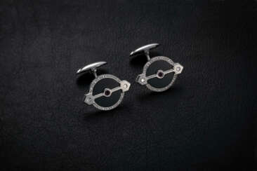 GIRARD-PERREGAUX, A FINE AND ELEGANT PAIR OF 18K WHITE GOLD AND ONYX GOLDEN BRIDGE CUFFLINKS