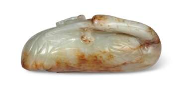 A PALE GREENISH-WHITE AND RUSSET JADE CARVING OF A RECUMBENT CRANE