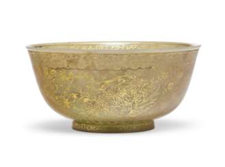 A GILT-DECORATED PALE GREEN JADE BOWL