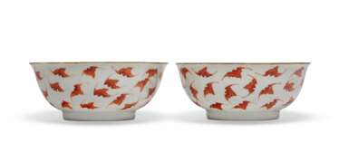 A PAIR OF IRON-RED-ENAMELED `BATS' BOWLS