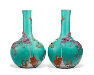 A PAIR OF FAMILLE ROSE MOLDED `DRAGON AND CARP’ BOTTLE VASES